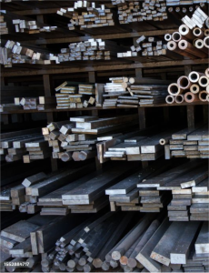 Racks of steel bar stock ready for aerospace machining.