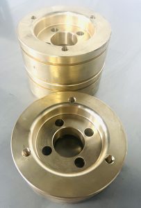 Precision-machined bronze aerospace components showing strength, corrosion resistance, and high durability.