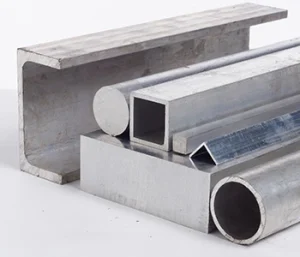 Extruded aluminum profiles used in aerospace machining.